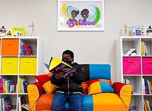 Photo of student reading a book. 