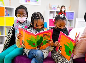 Photo of girls reading Chicka Chicka Boom Boom