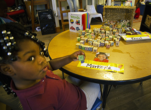 Photo of girl with alphabet blocks